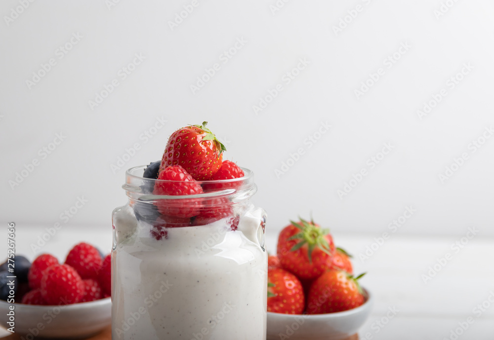 yogurt with fruit on a breakfast table on a white background yogurt with fruit on a breakfast table on a white background
