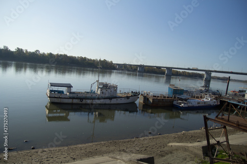 old ship  on the river bank. beautiful river landscape in a bright sunny day