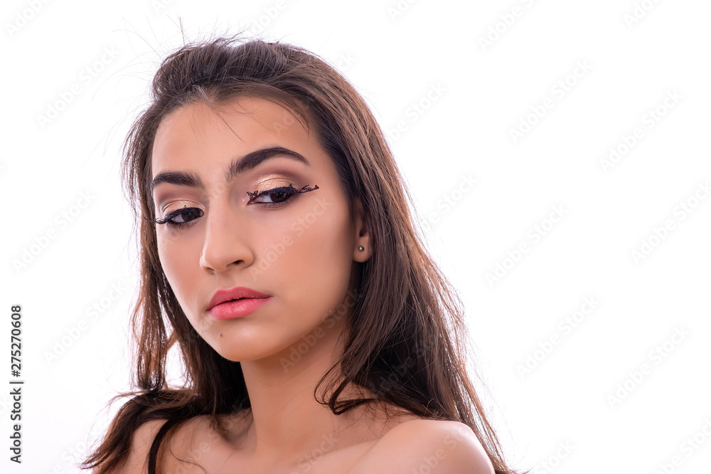 Portrait of Attractive Young Female Model. The girl poses with butterflies as eyelashes in a studio with a white background. Portrait of Attractive Young Female Model. The girl poses with butterflies as eyelashes in a studio with a white background.