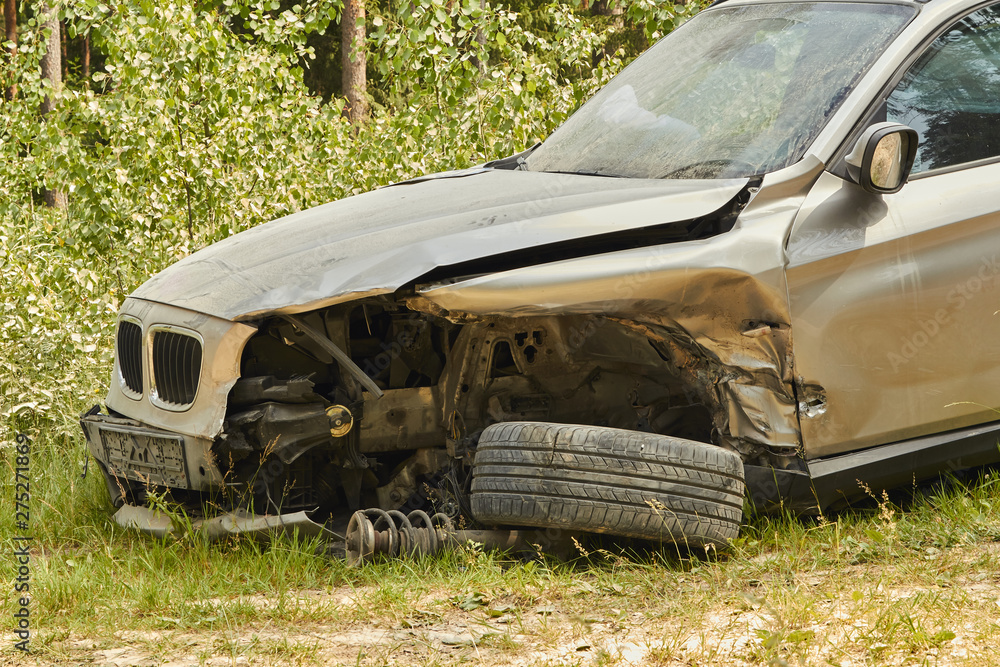 Car accident on country road in the middle of forest in June Car accident on country road in the middle of forest in June