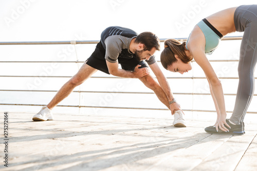 Attractive sporty young fitness couple