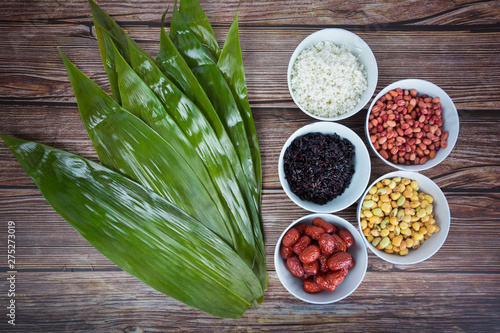 The ingredients of zongzi in the background of wood grain photo