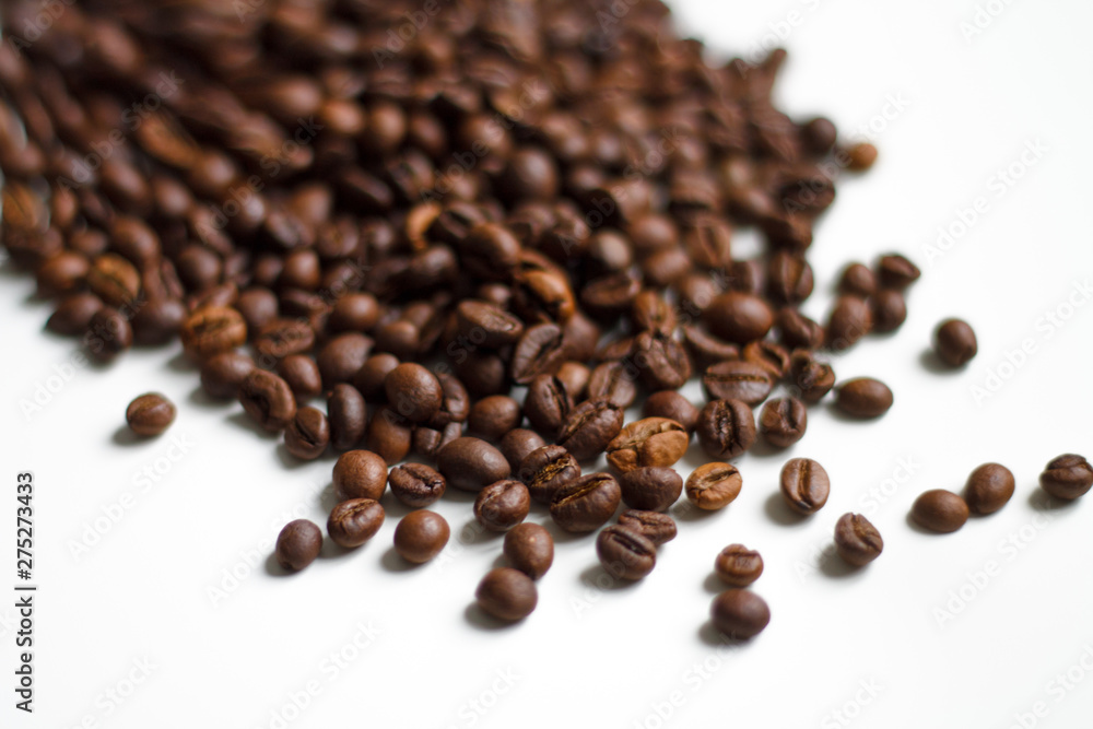 coffee beans brown on white isolated background with close-up location with blurred background coffee beans brown on white isolated background with close-up location with blurred background