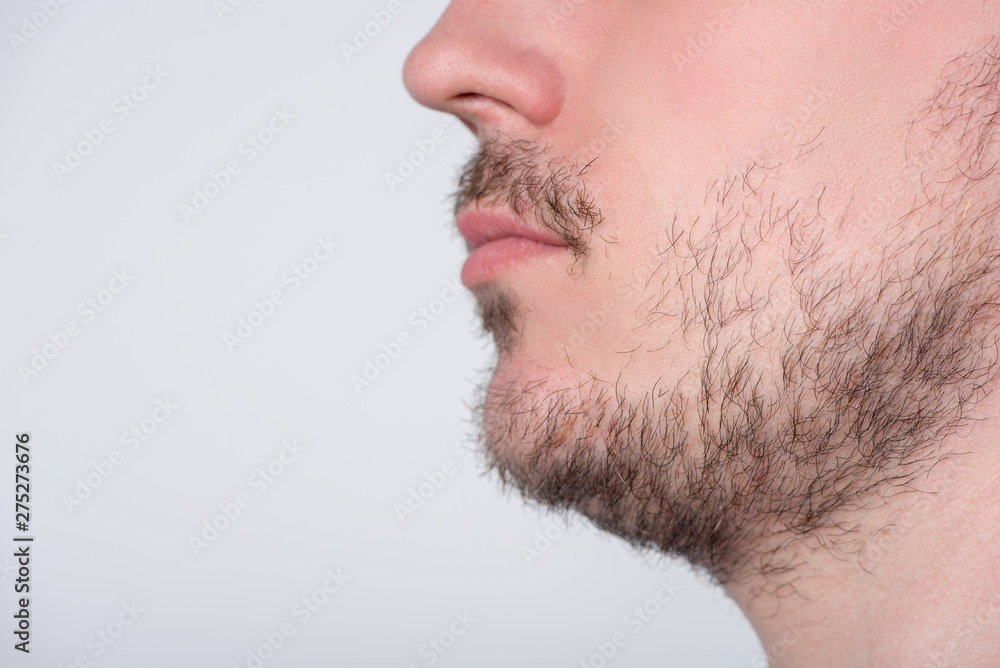 Handsome man with stubble or beard on face close up Handsome man with stubble or beard on face close up