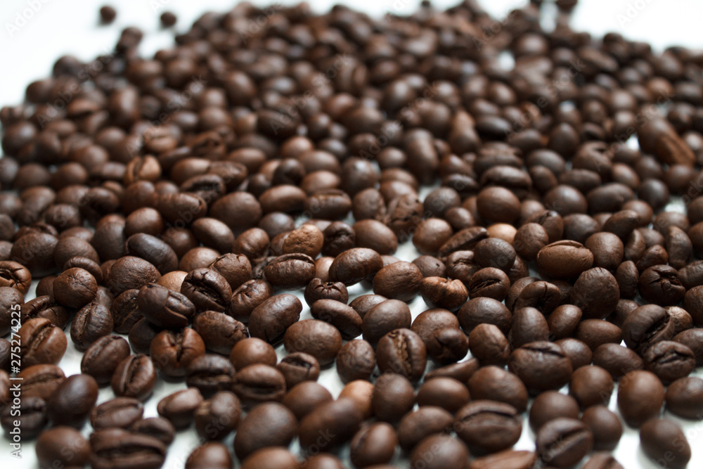 coffee beans brown on white isolated background with close-up location with blurred background coffee beans brown on white isolated background with close-up location with blurred background