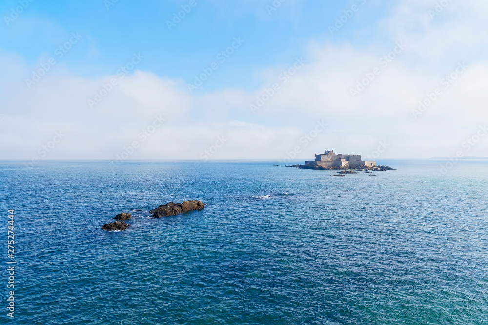 Low mist coming across the English Channel begins to creep towards Fort National near St Malo Low mist coming across the English Channel begins to creep towards Fort National near St Malo