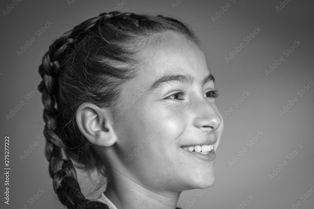 Isolated close up portrait of a beautiful young girl