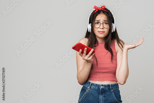 Cute teenage girl wearing casual outfit standing