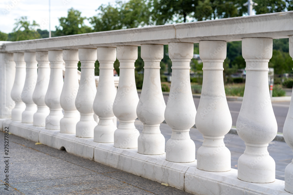 Fototapeta premium white palace railings with blown props. Beautiful classical architecture. Luxury street railings.