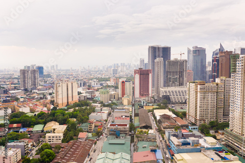 The city of Manila, the capital of the Philippines. Modern metropolis in the morning, top view. New buildings in the city. Panorama of Manila. Skyscrapers and business centers in a big city.