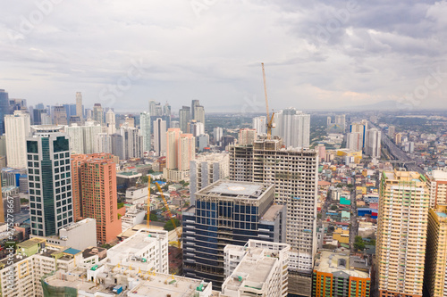 Modern city. The city of Manila  the capital of the Philippines. Modern metropolis in the morning  top view. Modern buildings in the city center.