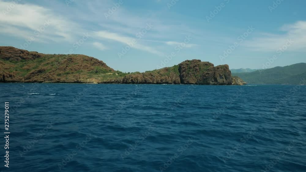 Sail on the blue sea near the rocks Sail on the blue sea near the rocks