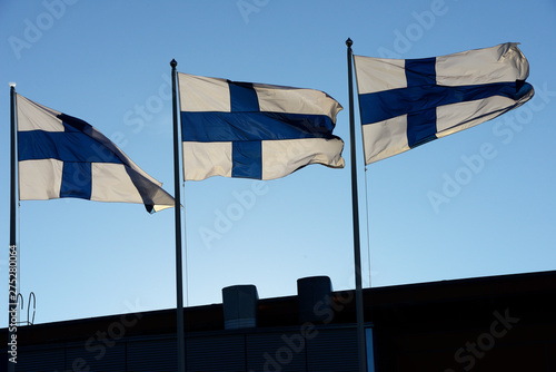 waving flags of Finland Fototapet