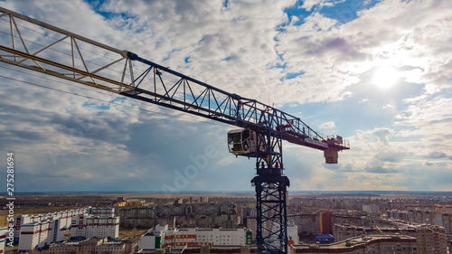 the crane installation above the city, photographed by a drone from close range