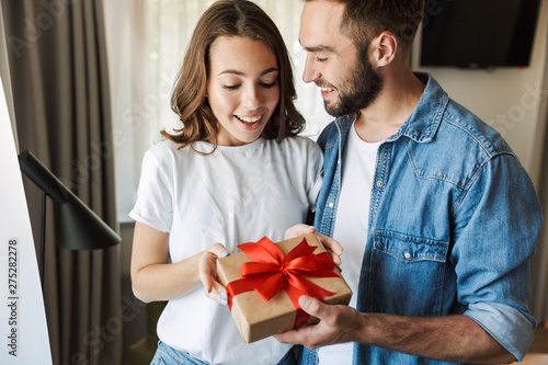 Beautiful young couple in love at home