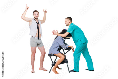 The theme relaxation and rest in office. The queue of employees will be waiting for a massage at the invited specialist. Head and neck massage on the chair. Cheerful Caucasian man in shorts and tie