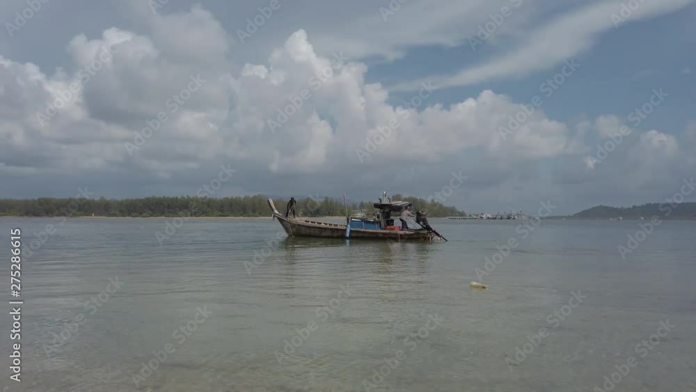Fishing boat moving through a bay in Thailand. Fishing boat moving through a bay in Thailand.