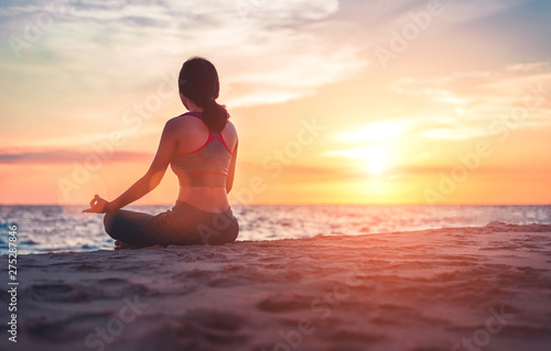 yoga or meditation concept background, silhouette on the beach
