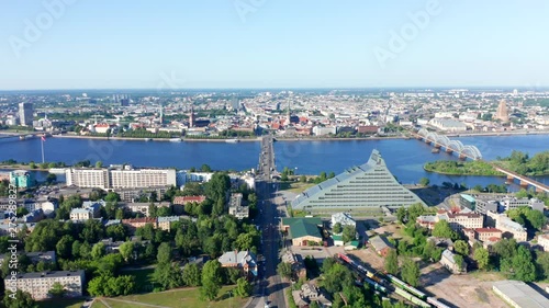 Riga Drone Timelapse, All sightseeings visible, Library, Old Town, Bridges, Beautiful Sunset, Daugava River photo