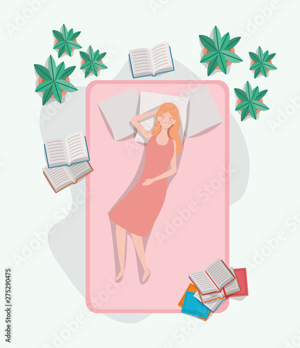 young woman relaxing in mattress in the bedroom