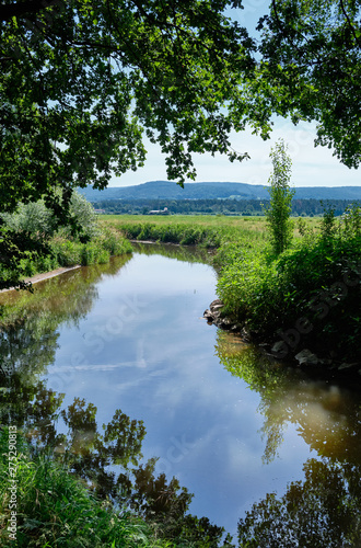 Beautiful scenic view in a landscape near the town of Alzenau in Lower Franconia  Bavaria  Germany  with the river Kahl an the hills of the Spessart in the background