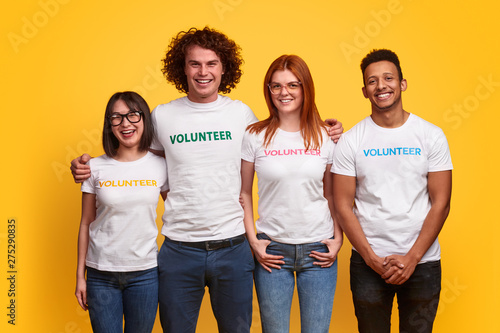 Multiethnic volunteers smiling for camera photo
