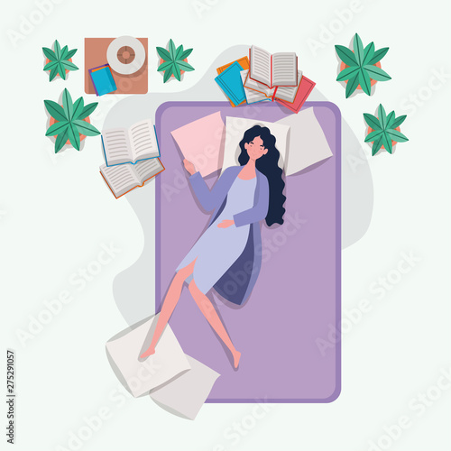 young woman relaxing in mattress in the bedroom