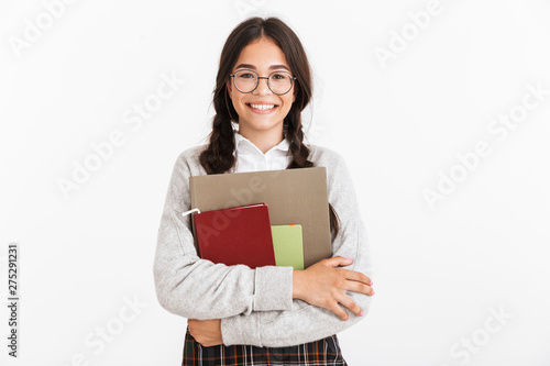 Attractive schoolgirl wearing unifrom standing