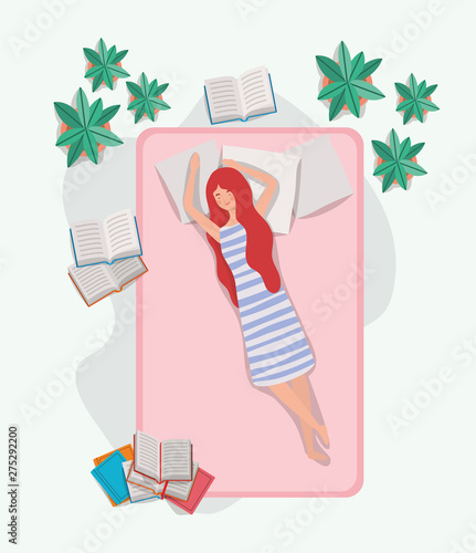 young woman relaxing in mattress in the bedroom