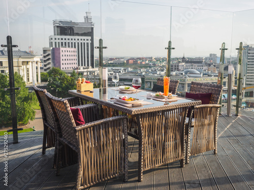 Sky cafe on the roof terrace with view of modern city