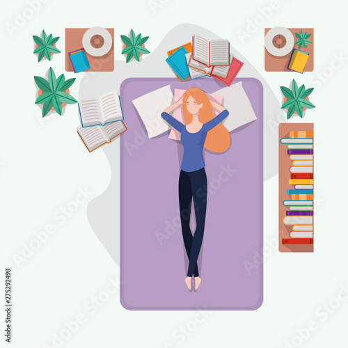 young woman relaxing in mattress in the bedroom