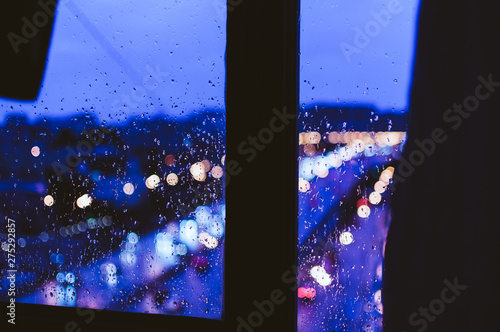View from the window to the rainy city. Background, screen saver, wallpaper
