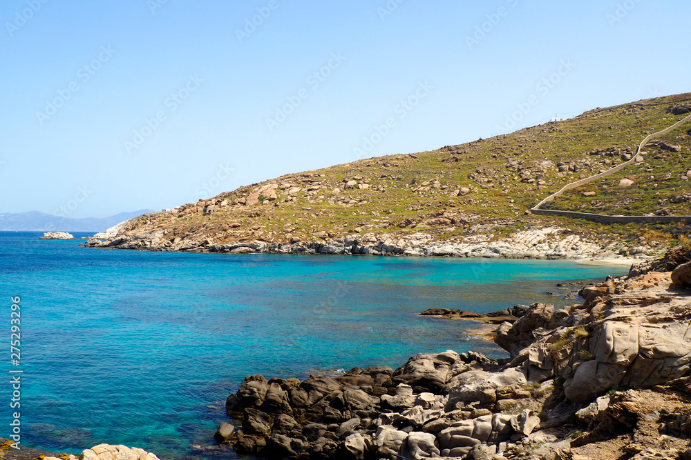 beautiful sunny beach of Saint Ioannis (Agios Ioannis) on the peninsula of Diakoftis in Mykonos (Greece), island of Cyclades, in the heart of the Aegean Sea