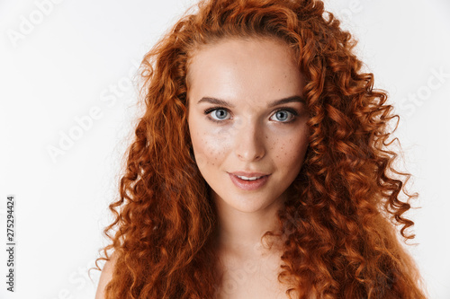 Portrait of an attractive woman with long curly red hair