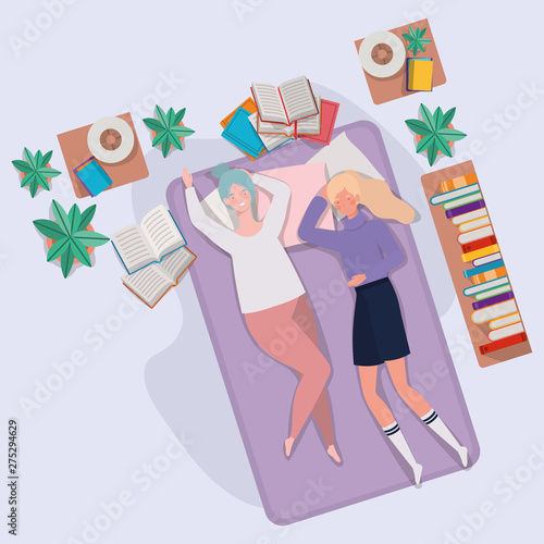 young women relaxing in mattress in the bedroom