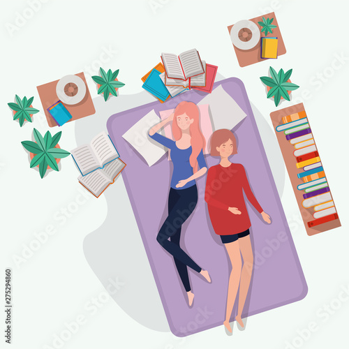 young women relaxing in mattress in the bedroom