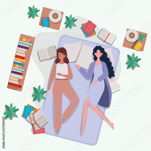 young women relaxing in mattress in the bedroom