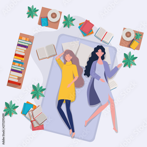 young women relaxing in mattress in the bedroom