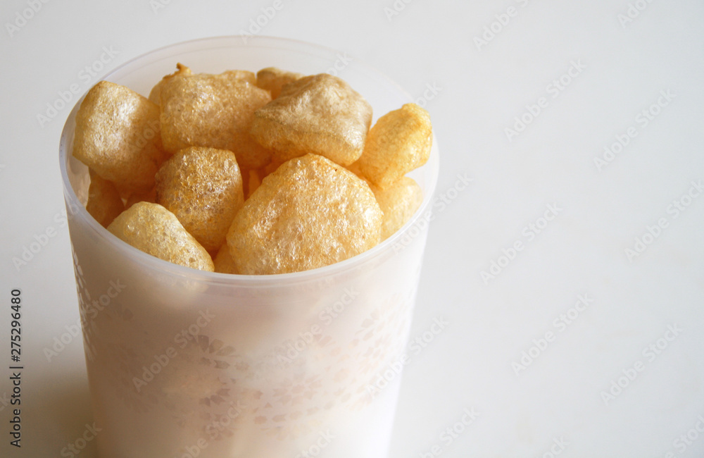 Cattle skin crackers on white background. Cattle skin crackers on white background.