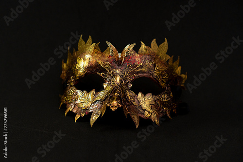Cosplay, Venetian mask in gold and red with metallic pieces in the form of leaves. original and unique design, handmade crafts