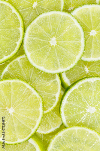 Valokuva Limes citrus fruits lime collection food background portrait format fresh fruit