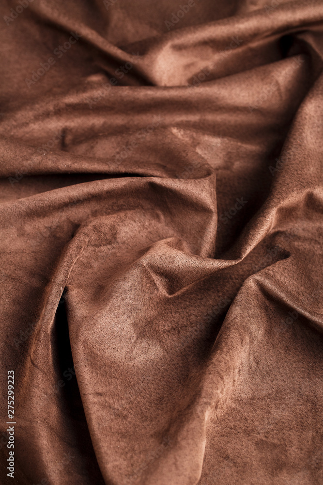 Brown velor textural background pattern. Gorgeous elastic velor fabric has a velvet pile, shine and texture. Brown velor textural background pattern. Gorgeous elastic velor fabric has a velvet pile, shine and texture.