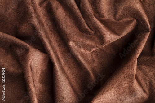 Brown velor textural background pattern. Gorgeous elastic velor fabric has a velvet pile, shine and texture.