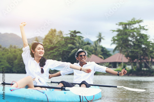 Couples are kayaking with a happy holiday. © boonchok