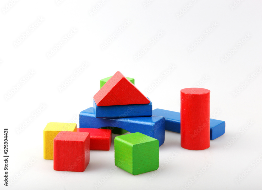Obraz premium Studio Shot Of Colorful Toy Blocks Against White Background