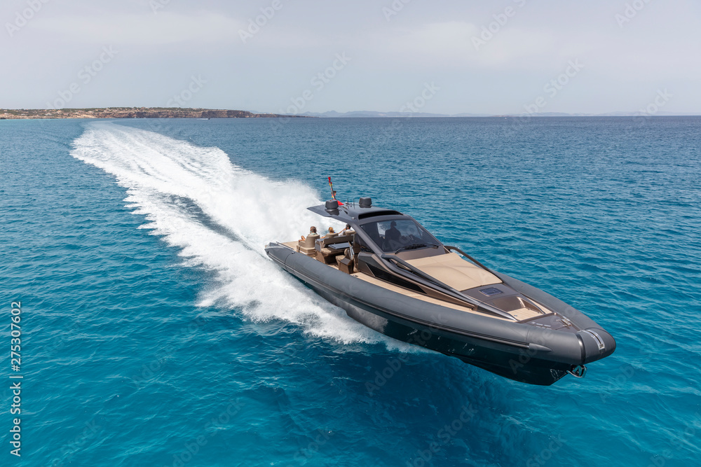 Fototapeta premium inflatable motor boat in formentera, spain