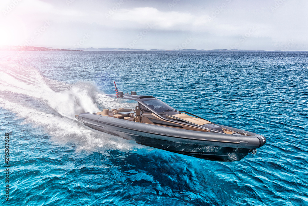 Fototapeta premium inflatable motor boat in formentera, spain