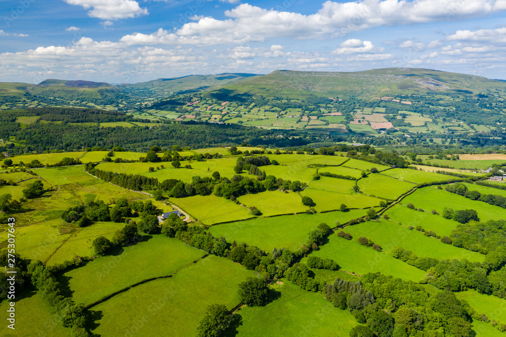 Aerial drone view of beautiful green fields and farmland in rural South Wales