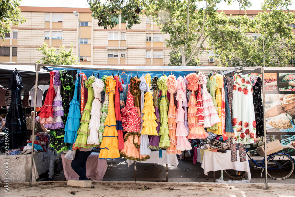 Colorful sevillana costumes at a street market in Spain