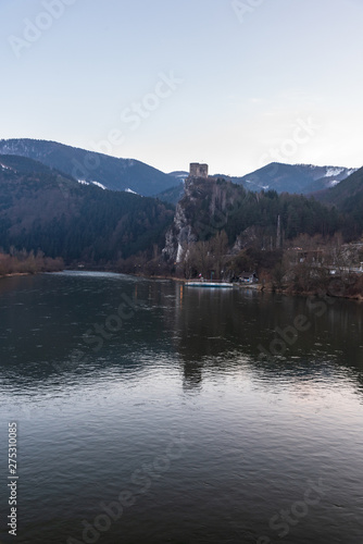 Vah river with Strecno castle ruins and hills of Mala Fatra mountains above in Slovakia